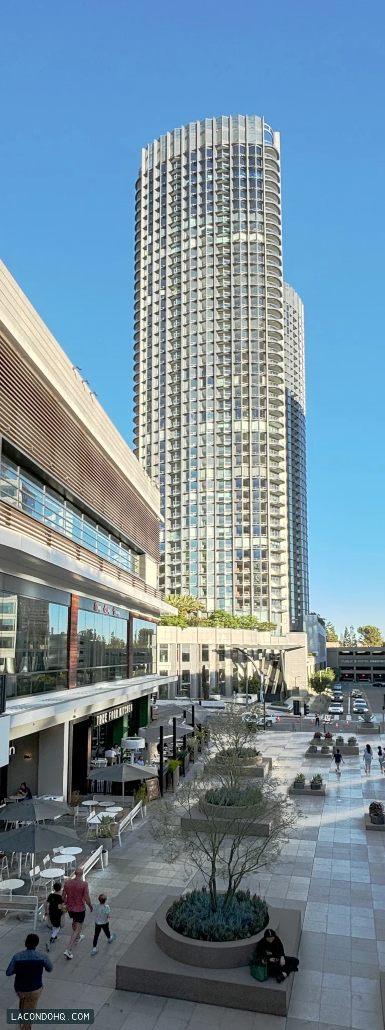 Park Elm at Century Plaza’s curved residential tower seen from the Westfield Century City terrace, photographed in August 2024.