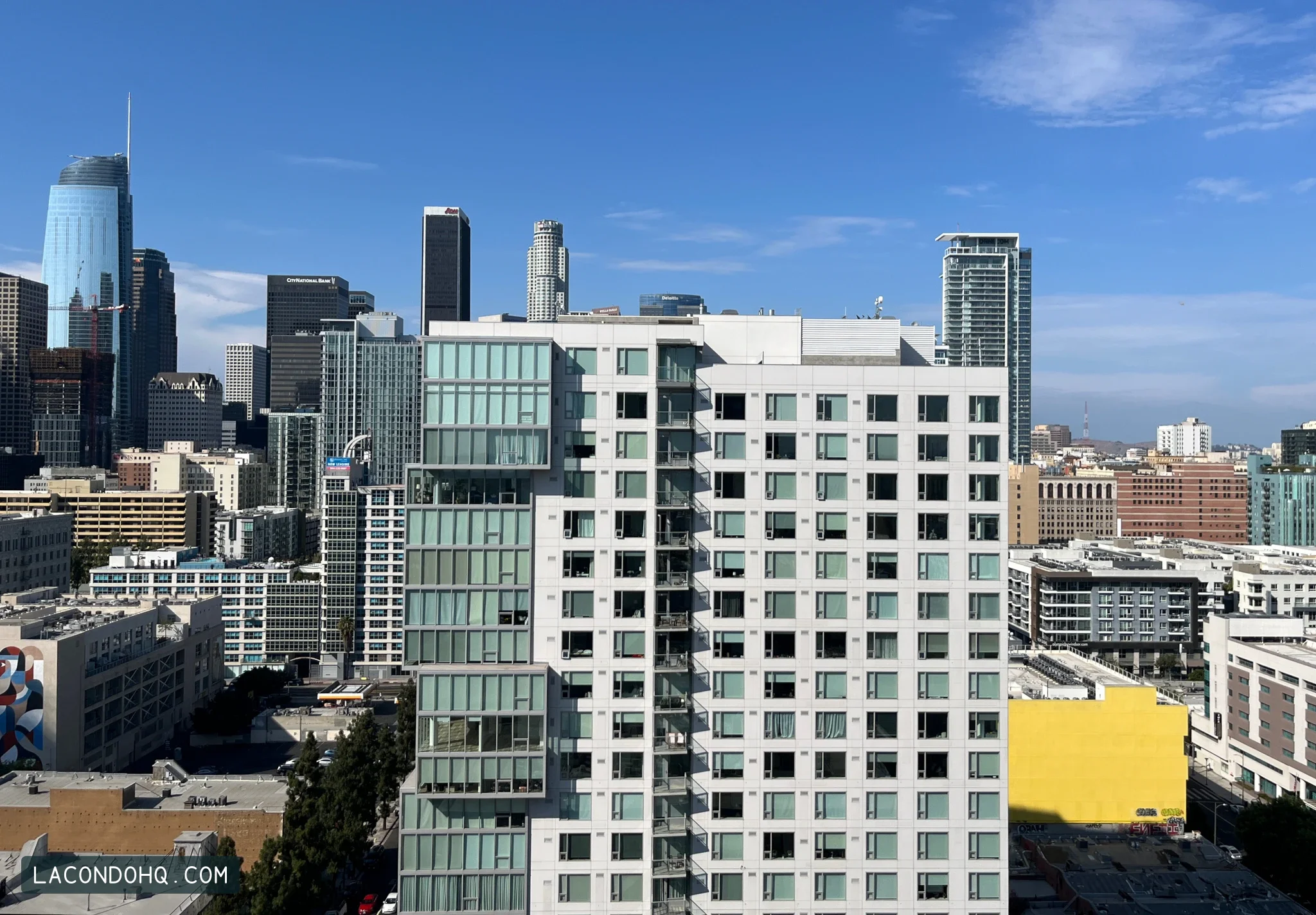 Ten50’s white-grid and glass facade among South Park towers in Downtown Los Angeles, photographed in July 2022.